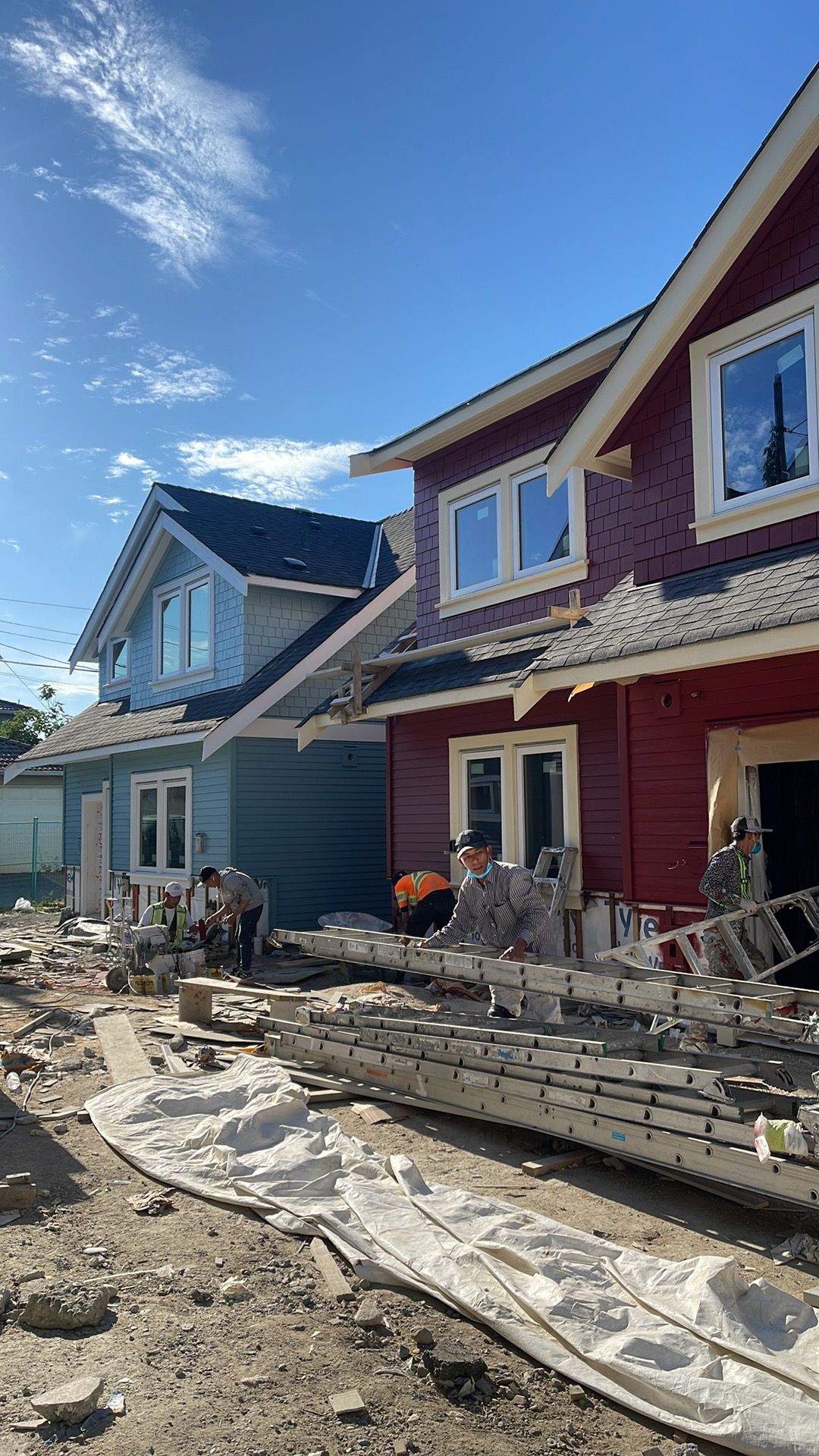 3 Pro Painting crew repainting a row of townhouse exteriors in Vancouver